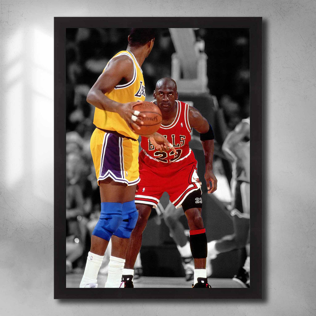 Black framed NBA art by Sports Cave featuring Michael Jordan Staring down Magic Johnson. 