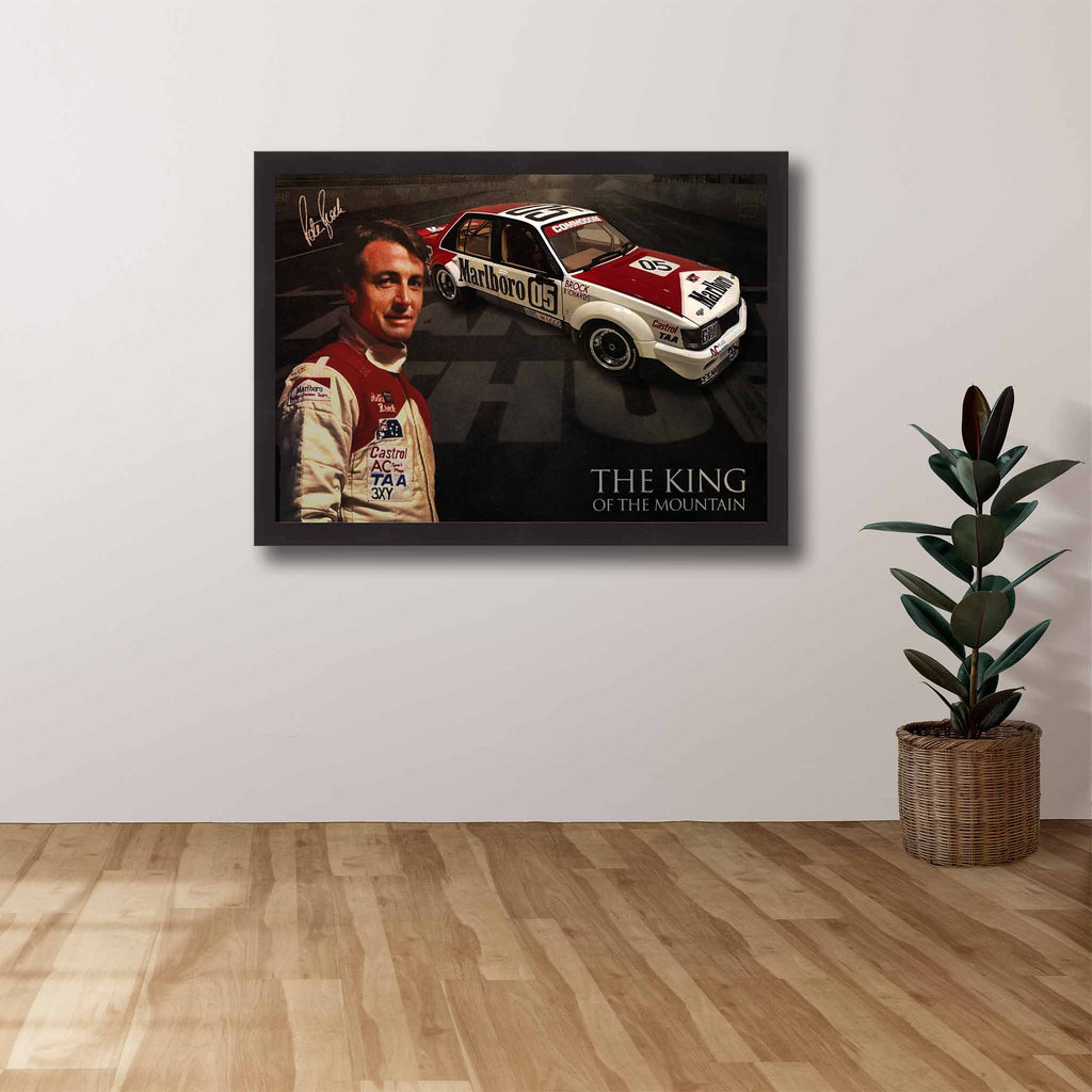 Peter Brock fan with a framed art of Brock displayed on there wall.